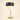 Brushed gold curve table lamp with a black drum shade and white inner, lamp on