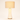 Off-white glass hourglass table lamp with a tan linen drum shade, lamp on