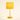 Ochre yellow bobbin table lamp with a matching mustard drum shade, lamp on