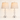 Pair of washed-white spindle table lamps with oatmeal linen shades, both lamps on