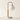 Globe table lamp with white marble disc base, light wood cylinder stem, brass J-hook, and unlit frosted glass globe, lamp off