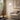 Brass Ring Arc Floor Lamp beside sofa, shade over seat