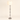 Three-quarter view of the nickel glass column floor lamp, lit