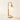 Three-quarter view of the Globe table lamp with marble disc, wood stem, brass J-hook, and glowing frosted globe, lamp on
