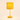 Three-quarter view of the ochre bobbin table lamp with the shade on