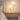Dual globe table lamp on a pale oak nightstand, both globes on