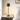 Black cordless table lamp on a quiet nightstand, shade on