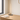 Slim vertical LED table lamp on a light oak writing desk, lamp on