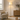 Marble wood floor lamp beside a sofa, lit, floor standing