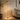 Gold dome floor lamp beside a sofa, lit, floor standing