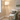 Natural Wood Three-Leg Floor Lamp in living room corner
