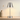 Nickel cordless table lamp on a console with one ceramic vase, shade on
