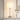 Nickel glass table lamp on a console with one ceramic vase, shade on