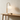 Globe table lamp on a wood console with a ceramic bowl, lamp on
