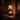 Matte black candle warmer on an entry table, moody amber gothic room