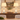 White wood lantern pair on a dining buffet sideboard, late-afternoon glow, both lamps on.