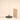 Slim vertical LED table lamp next to a book for scale, lamp on