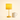 Ochre bobbin table lamp next to a ceramic mug for scale, shade on
