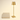 Gold cordless table lamp next to a book for scale, lamp on