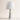 Marble Cone table lamp with 25 inch height and 14 inch width overlays
