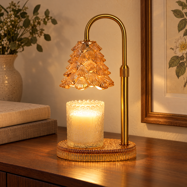 Amber Glass Tree Candle Warmer Lamp glowing on a walnut console in the evening