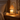 Amber Glass Tree Candle Warmer Lamp on an oak nightstand at night