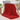 Red chunky knit weighted blanket draped over an oak armchair