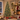 Frosted pre-lit Christmas tree glowing by a fireplace