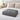 Gray weighted throw blanket folded on a bed with white bedding