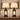 Closeup of black metal lantern farmhouse pair — square to console, both lamps on, clean stems.