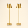 Pair of slim brushed-gold cordless table lamps with cone shades and square bases, lamps on