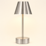 Small brushed-nickel cordless table lamp with a metal cone shade, lamp on