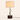 Walnut twist table lamp with a linen drum shade and bronze twisted stem, lamp on