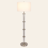Nickel glass column floor lamp with white linen drum, lit, cream studio