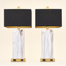 Pair of rectangular faux-marble table lamps with gold bases and black box shades, both lamps on