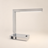 Polished chrome L-shaped LED desk lamp with underside LED strip, lamp on