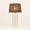 Crystal cylinder table lamp with a charcoal pleated tapered shade on a cut-glass base, lamp on