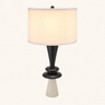 Geometric column table lamp with a tall white drum shade and light gray stone foot, lamp on