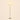 Gold tier floor lamp with three-step cream linen shade, lit, cream studio