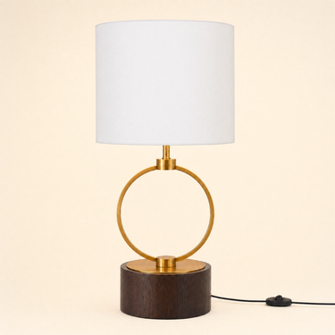 Dark wood cylinder with a vertical gold ring and a white fabric drum shade, lamp off