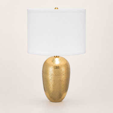 Gold mesh table lamp with a tall white drum shade and textured gold egg base, lamp off
