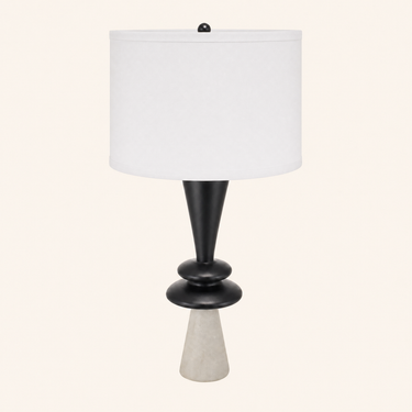 Geometric column table lamp with a tall white drum shade and light gray stone foot, lamp off
