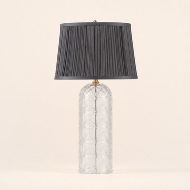 Crystal cylinder table lamp with a charcoal pleated tapered shade on a cut-glass base, lamp off