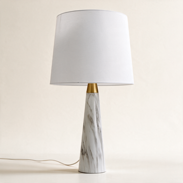 Marble Cone table lamp with tapered white marble cone base, short gold neck, and unlit white fabric drum shade, lamp off