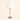 Brushed nickel table lamp with a clear glass cylinder and white fabric shade, lamp off