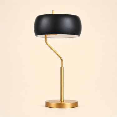 Brushed gold curve table lamp with a black drum shade and white inner, lamp off