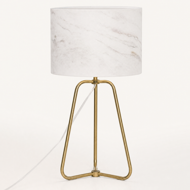 Bronze tripod table lamp with a marble-pattern drum shade, lamp off