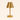 Small brass cordless table lamp with a metal cone shade, lamp off