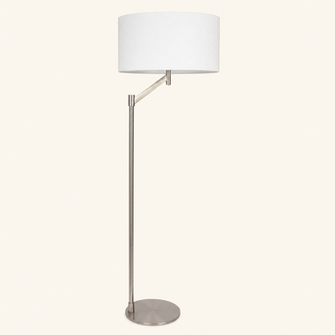 Brushed nickel swing-arm floor lamp with white linen drum shade, unlit, same camera