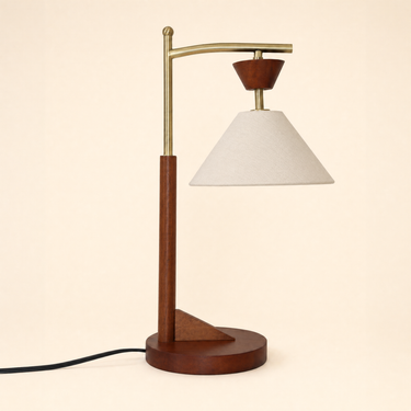 Dark wood post with a brass crane arm and cream cone shade, lamp off